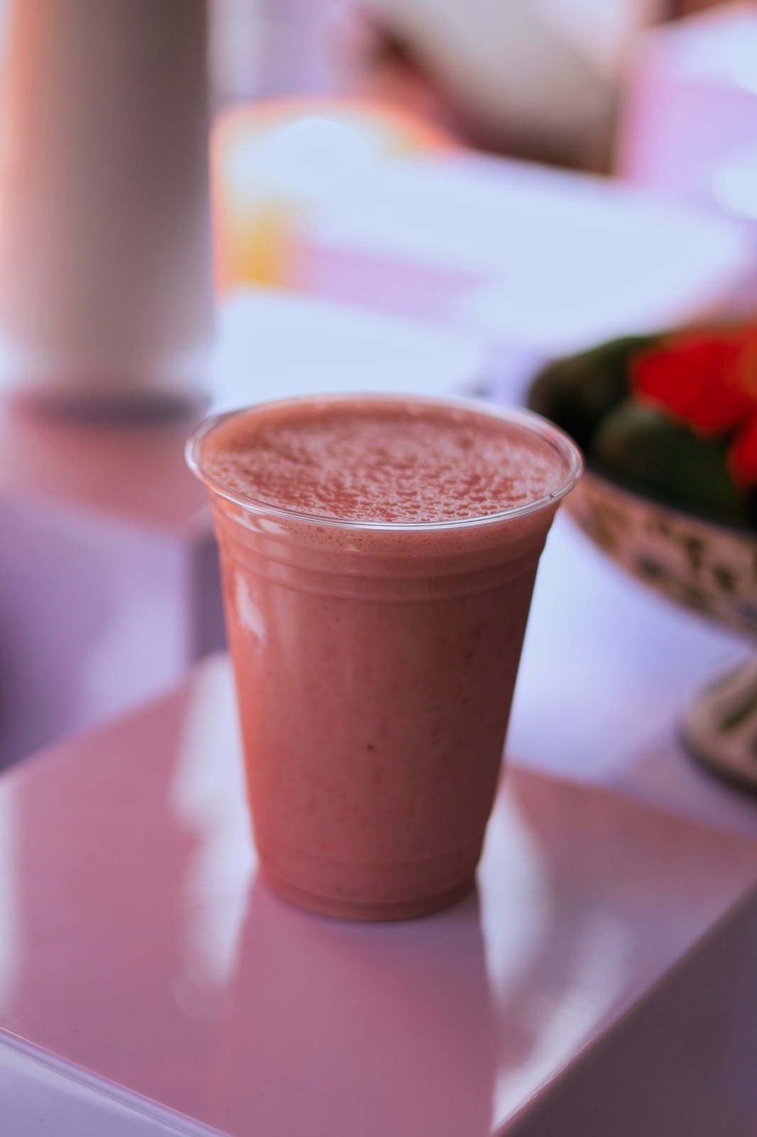 Pink smoothie in a clear cup