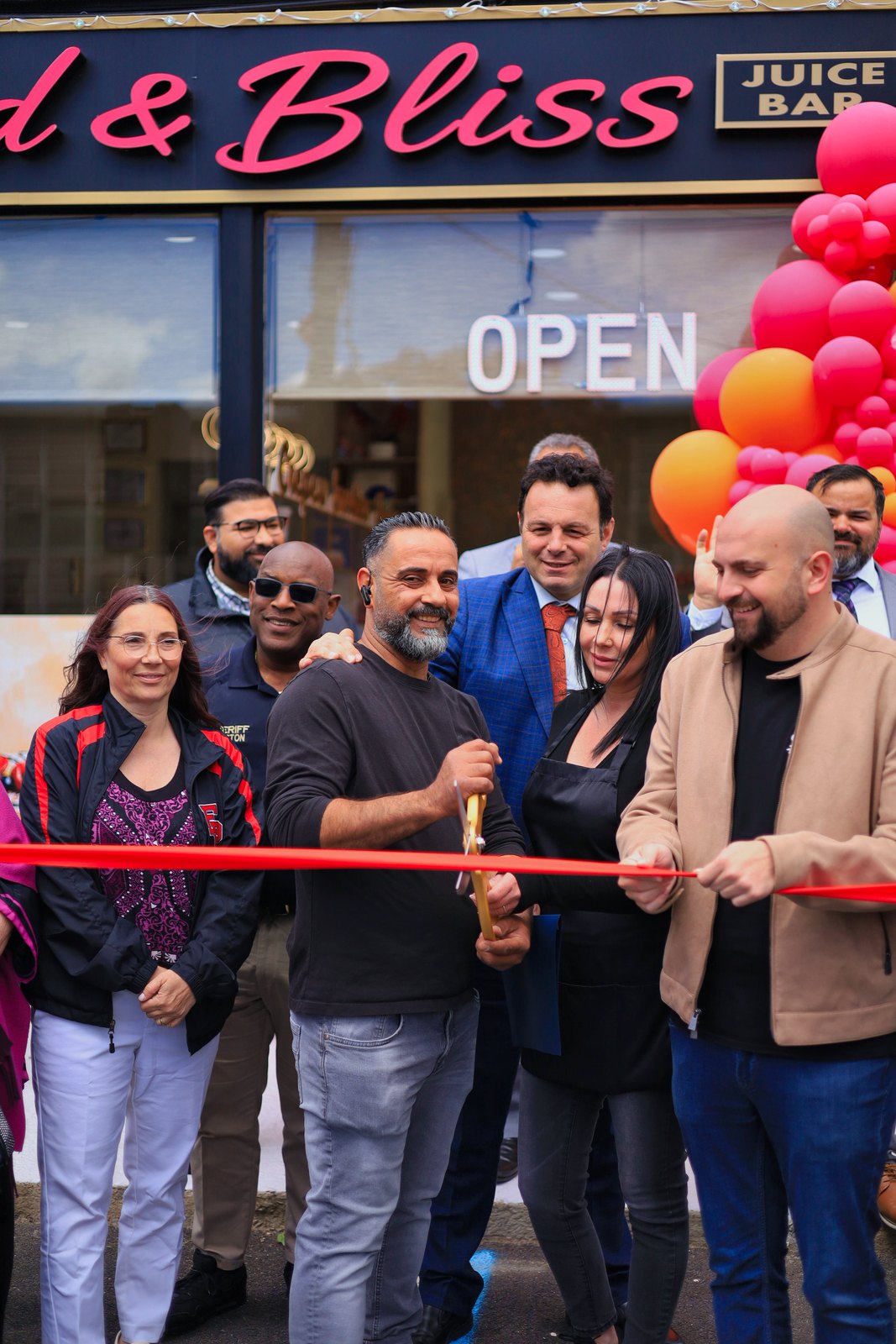 Ribbon cutting celebration outside Blend and Bliss