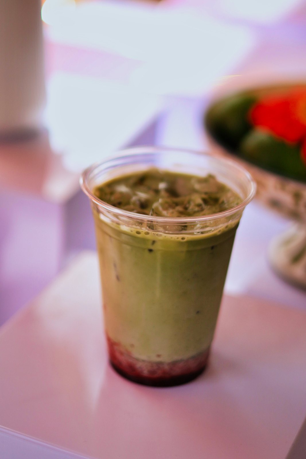 Green iced matcha drink with strawberry