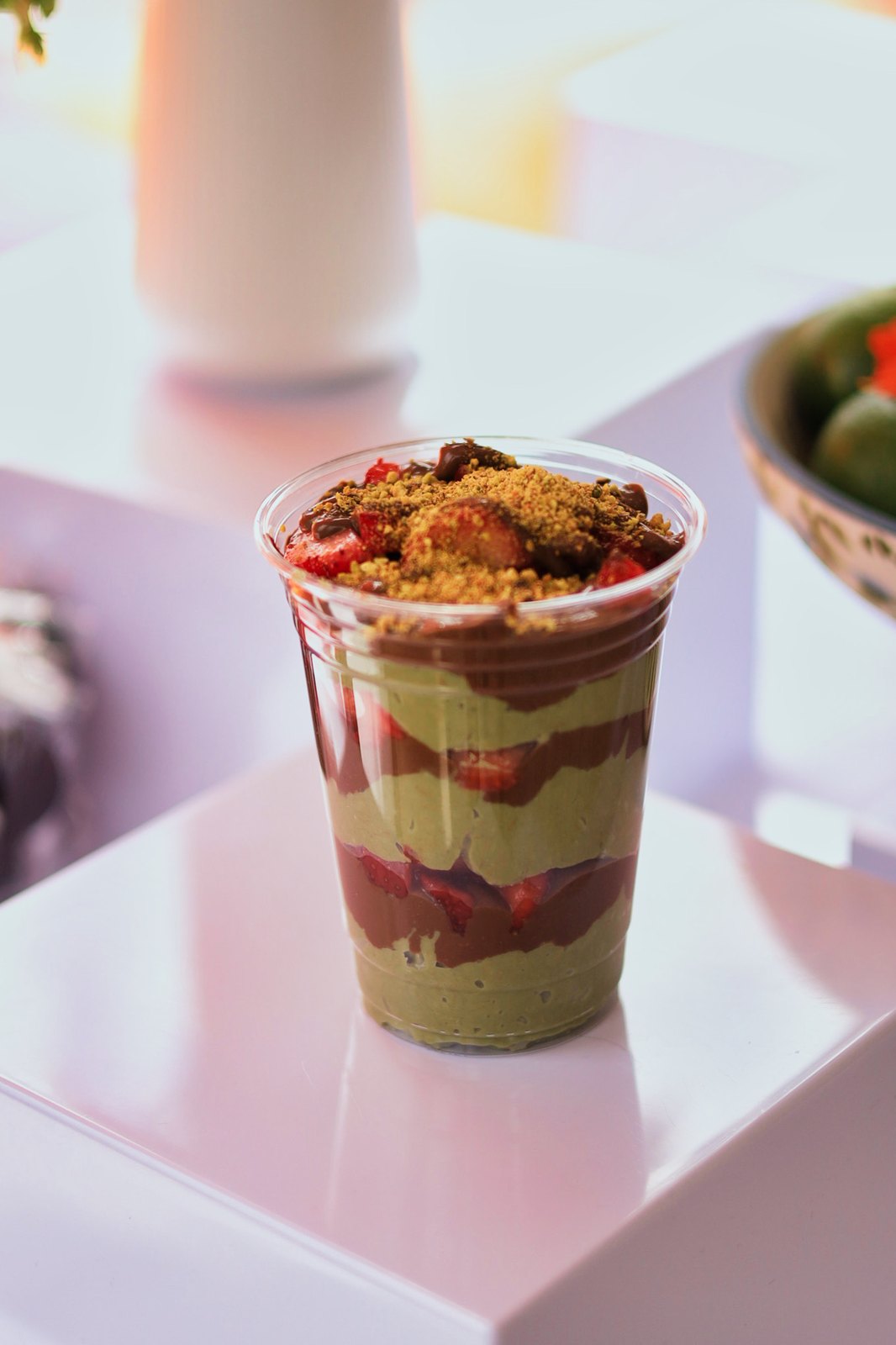 Layered dessert cup with toppings